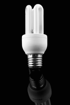 Light bulb on black background, energy saverの写真素材