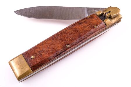 pocket knife with wood handle isolated over whiteの写真素材