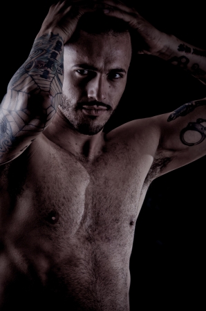 Muscular young man with many tattoos, dragan styleの写真素材