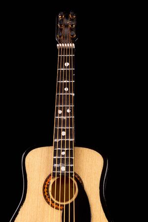 Music concept  guitar crop under beam of lightの写真素材