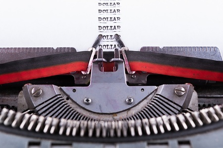  dollar written on an old typewriter  の写真素材