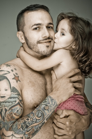 Father and daughter,  man with tattooの写真素材