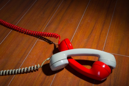 Old vintage phone handsets on woodの写真素材