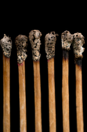 buerned matches, close-up, black background
