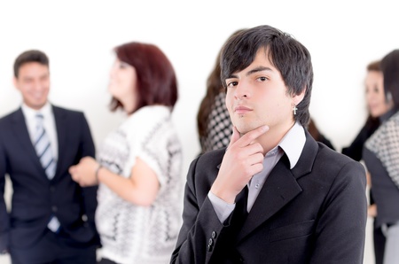 Alternative business man in front of a group of peopleの写真素材