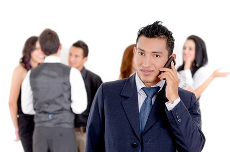 Businessman using a cellphone with peersの写真素材