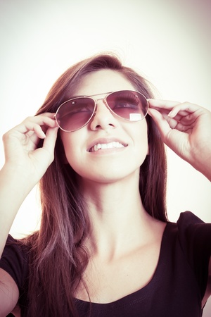 Attractive young woman posing  in sunglassesの写真素材