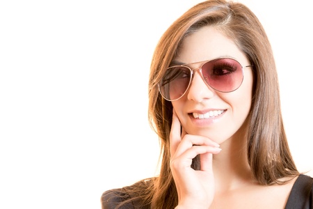 closeup fashion beautiful woman portrait with long hair wearing sunglassesの写真素材