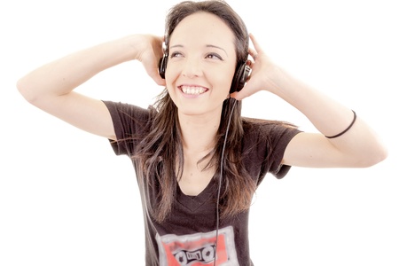 Young beautiful girl happy listening to musicの写真素材