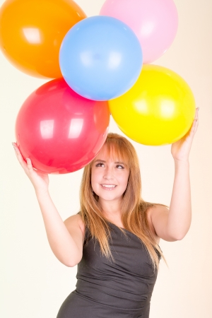 happy cute woman with balloonsの写真素材