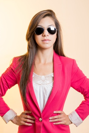 Attractive young woman posing  in sunglassesの写真素材