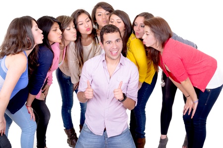 eight young women kissing  handsome man standing between them - isolated on whiteの写真素材