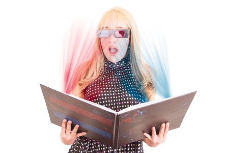 Smiling woman reading a book with 3d glasses conceptの写真素材
