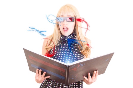 Smiling woman reading a book with 3d glasses conceptの写真素材