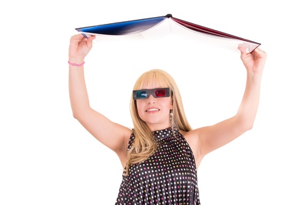 Smiling woman reading a book with 3d glasses conceptの写真素材