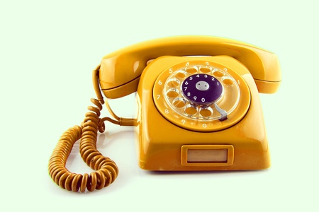  old Orange telephone with rotary dialの写真素材