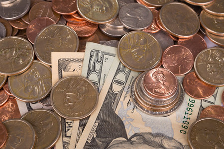 dollar bills with coins background