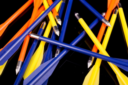 crossbow arrows with metal arrowheads on black backgroundの写真素材