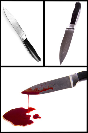 A knife smeared with blood isolated on whiteの写真素材