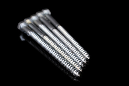 Screws on Black backgroundの写真素材