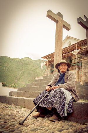 ANDAHUAYLILLAS PERU -JANUARY 15: Quechua woman begs for money at the main church in Andahuaylillas,...
