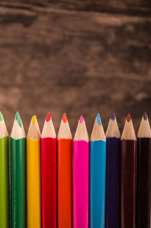 color pencils on wood backgroundの写真素材