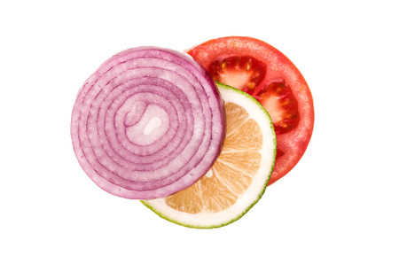 tomato lemon onion on a white backgroundの写真素材