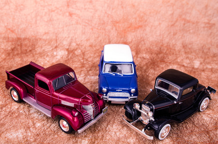 Vintage toy cars in an old backgroundの写真素材