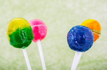 Lollipops of vaious colors in an abstract background