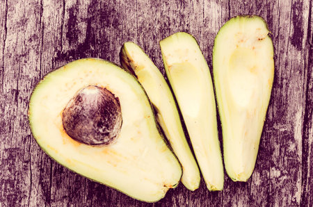 avocatto on wood background color processed
