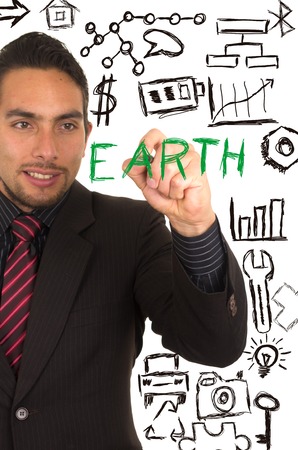 young handsome businessman writing EARTH on whiteboard with marker concept of conservation environment green protection preservationの写真素材