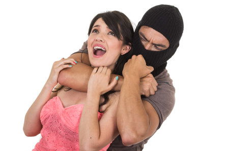 male thief holding strangling young scared girl isolated on whiteの写真素材