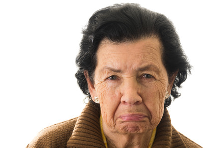 closeup portrait of old cranky grumpy sad woman grandmotherの写真素材