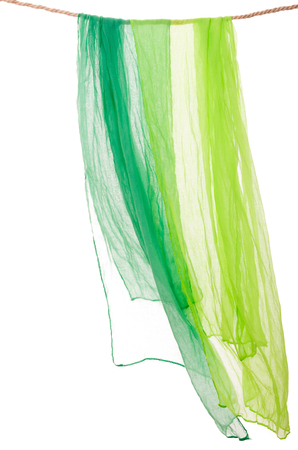 scarfs hanging on a rope clothesline isolated on whiteの写真素材