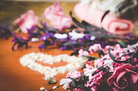 pink flowers oils soaps stones aromatherapy spa concept selective focusの写真素材