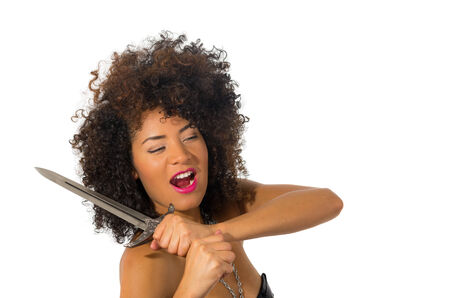 beautiful exotic young tribal woman holding a dagger isolated on whiteの写真素材