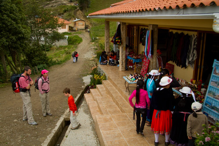 INGAPIRCA, CANAR, ECUADOR - JUNE 19, 2010: Unidentified tourists in the shops outside the archaelogical ruins of Ingapirca, Ecuadorのeditorial素材