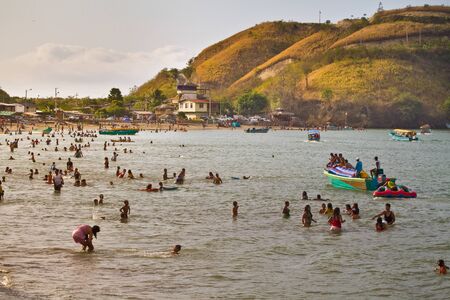 SUA, ESMERALDAS, ECUADOR - JANUARY, 1, 2013: Unidentified tourists enjoying the beach of Sua.のeditorial素材