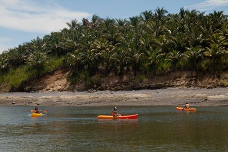 MOMPICHE, ECUADOR - APRIL, 18, 2010: Unidentified tourists kayaking between Portete island and Mompiche, a beautiful beach town in Esmeraldas, Ecuadorのeditorial素材
