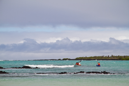 GALAPAGOS, ECUADOR - JULY 21, 2010: Unidentified tourists kayaking in Garraptero beach, Santa Cruz, Galapagos Islandsのeditorial素材