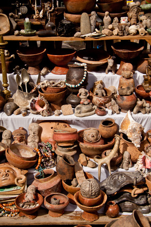 OTAVALO, ECUADOR - FEBRUARY 27, 2010: Stall with indigenous pottery figures in the popular Otavalo market.のeditorial素材
