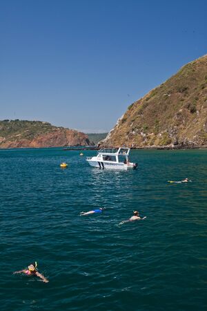 MANABI, ECUADOR - JUNE 4, 2012: Unidentified tourists enjoying a daytrip snorkeling in beautiful paradise beach in Salango island.のeditorial素材
