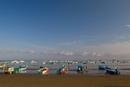 MANABI, ECUADOR - JUNE 3, 2012: Fishermen boats along a beach shore, Puerto Lopez.のeditorial素材