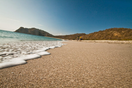 MANABI, ECUADOR - AUGUST 6, 2012: Beautiful view of foamy waves against white sand in Los Frailes beach, Parque Machalilla National Park, Ecuadorのeditorial素材