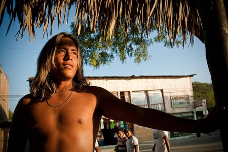 MANABI, ECUADOR - DECEMBER 18, 2011: Portrait of shirtless tanned young man from Puerto Lopez, popular vacation spot in Ecuadorのeditorial素材