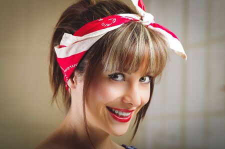 Closeup portrait of beautiful pinup girl with vintage styleの写真素材