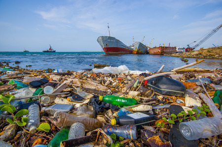 COLON, PANAMA - APRIL 15, 2015: Waste and pollution washing on the shores of the beach in city of Colon in Panamaの写真素材