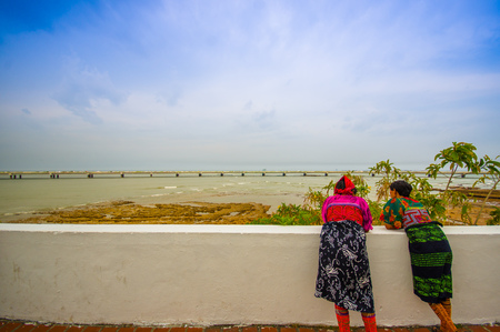 PANAMA, PANAMA - APRIL 16, 2015:   Street vendors haging out in the recentry restaurated historic quarter of Panama City, known as Casco Viejo.のeditorial素材