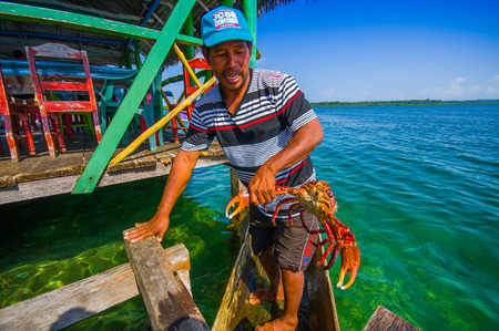 BOCAS DEL TORO, PANAMA - APRIL 24, 2015 : local fisherman returning with the morning catch, from local archipielagoのeditorial素材