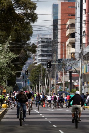 QUITO, ECUADOR - MARCH 31, 2013: Unidentified pedestrians and cyclists moving through Amazonas Avenue in a ciclopaseo or open street dayのeditorial素材